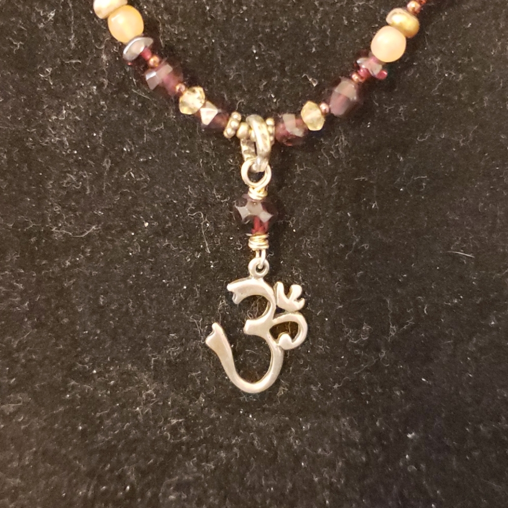 Ohm beaded necklace.